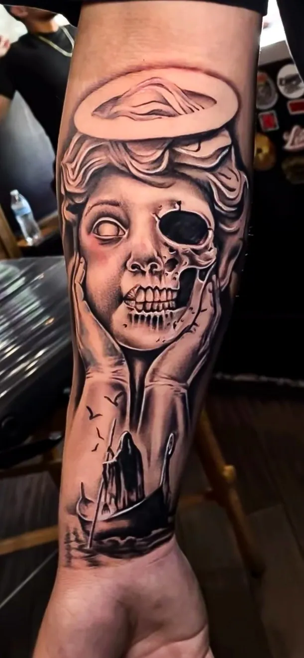 black and grey surreal skull figure sleeve tattoo by Steve Bachman, Long Beach
