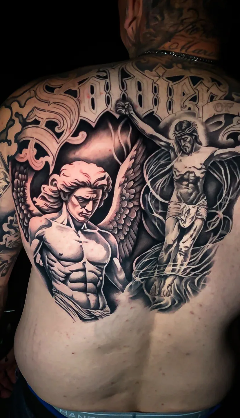 black and grey soldier and lettering back piece tattoo by Steve Bachman, Long Beach